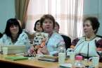 Зоя Сташук (у центрі) презентує нові видання